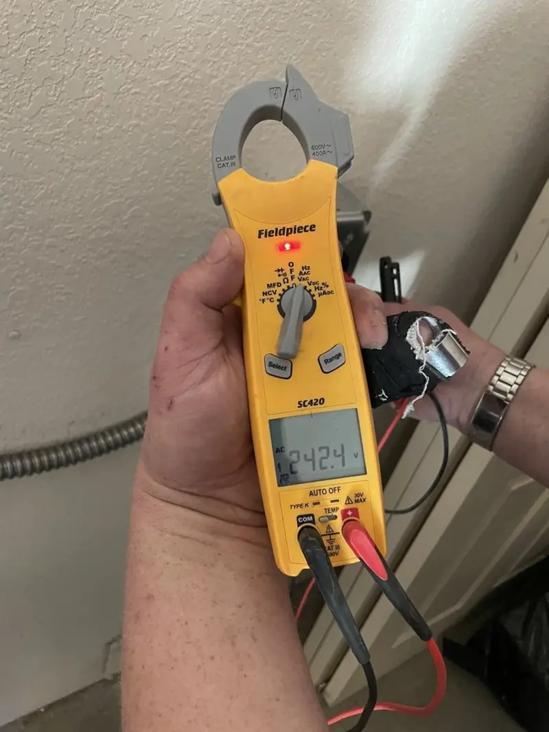 Voltage testing with clamp meter during Ceiling Fan Installation in South Brooksville
